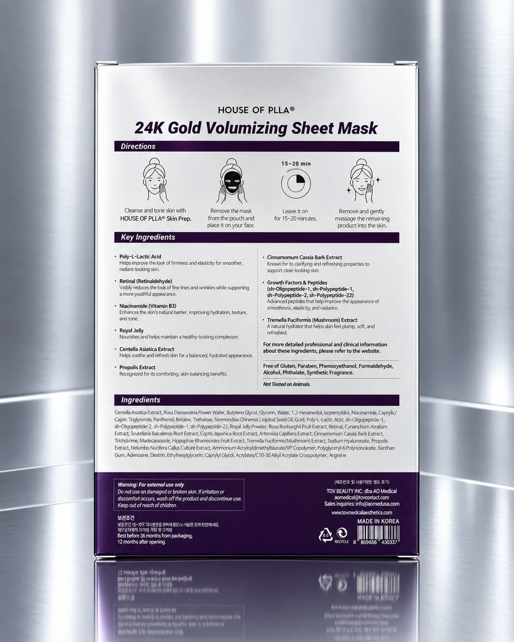 The back of a HOUSE OF PILA 24K Gold Volumizing Sheet Mask packaging, displayed vertically against a reflective metallic silver background.