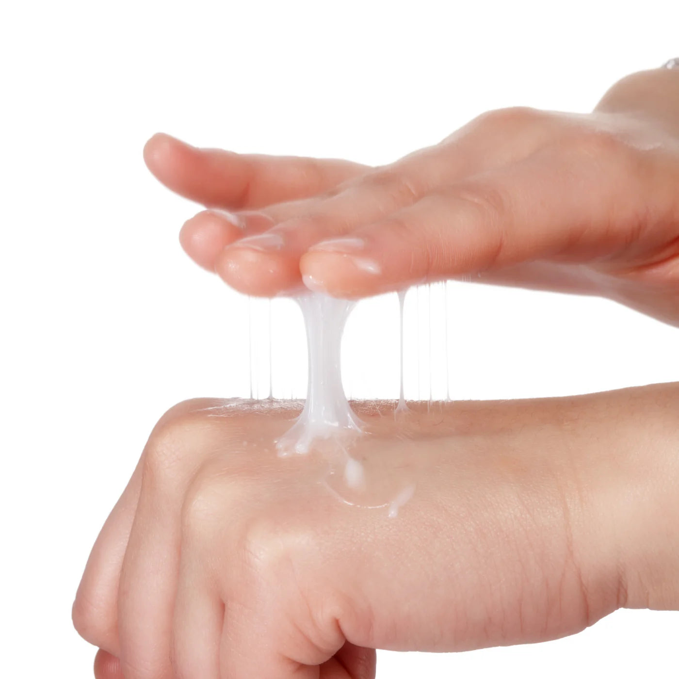 Close-up of a stretchy, gel-like moisturizer texture being pulled between two hands, demonstrating its rich consistency.
